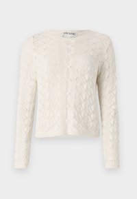 Lys kremfarget cardigan med et strukturert sikksakkmønster, rund hals og seks knapper foran. Lange ermer og ribbestrikket nederkant.