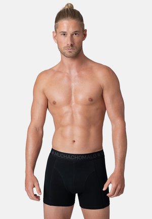Boxer briefs neri con un morbido elastico che presenta il nome del marchio. Realizzati in un tessuto liscio e elasticizzato per comfort e vestibilità.