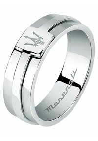 Anello argento con una finitura liscia e lucida. Presenta un logo a forma di corona quadrata al centro e una sottile incisione del marchio all'interno.