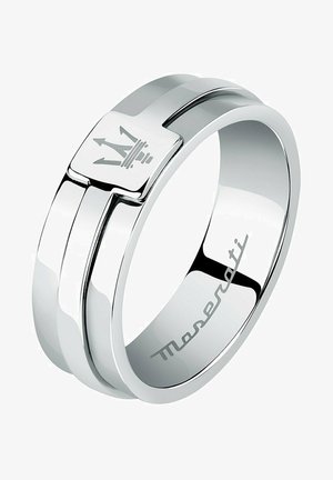 Zilverkleurige ring met een gladde, gepolijste afwerking. Heeft een vierkante kroonlogo in het midden en een subtiele merkgravering aan de binnenkant.