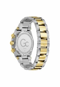 Klocka i rostfritt stål med silver- och guldfärgad ton, rund boett, kronograffunktion och en slät, polerad braceletdesign.