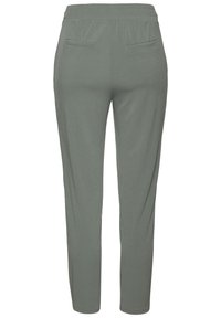 Light gray, elastic waist pants with a smooth texture, featuring two back pockets and a tapered leg design.