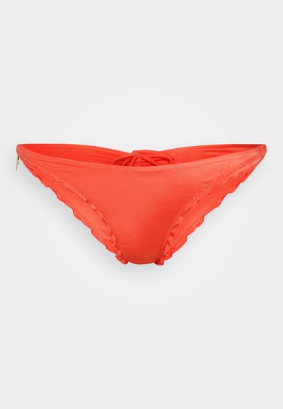 Red bikini bottoms with scalloped edges, a side zipper, and a tied bow at the back, shown against a plain background.