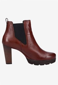 Brown leather ankle boot with a textured surface, elastic side panels, and a chunky wooden heel. The toe is rounded with a rubber outsole.