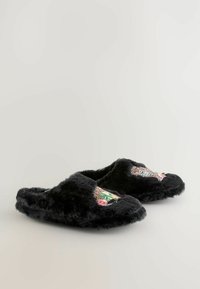 Black, fuzzy slippers with embroidered leopard design and floral accents on the side. Soft texture and rounded shape. No visible hardware.