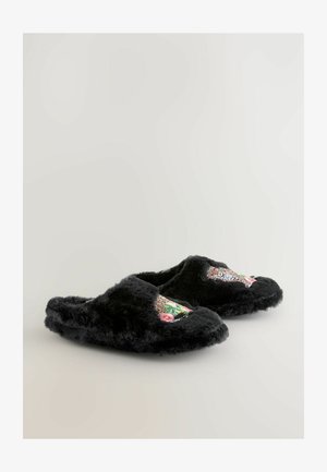 Black, fuzzy slippers with embroidered leopard design and floral accents on the side. Soft texture and rounded shape. No visible hardware.