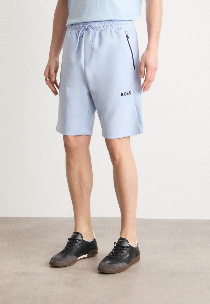 BOSS HEADLO - Spodnji deli trenirk - light blue