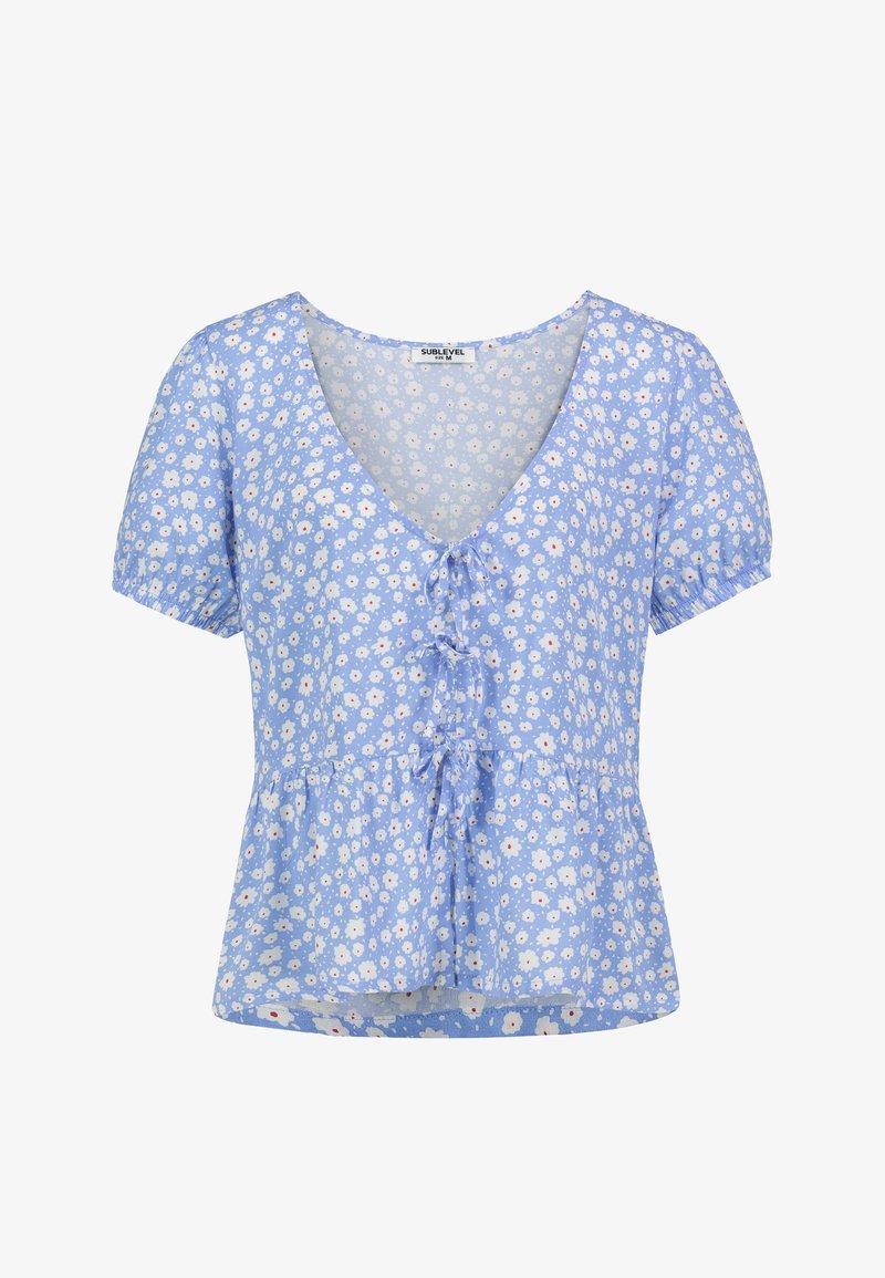 Hellbluse mit floralem Muster, kurzen Puffärmeln, V-Ausschnitt und gestuftem Peplum Saum. Hat kleine weiße und rosa Gänseblümchen-Muster.