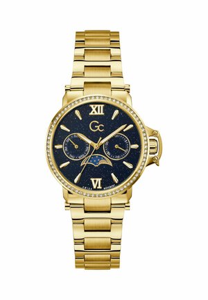 Kuldne käekell sinise tähtedega sihverplaadiga, Rooma numbrid 12 ja 6 juures, kristallraam, näitab päeva, kuupäeva alamkettad ja kuu faasi näidik.