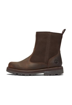 Brown leather ankle boot featuring a smooth toe cap, textured suede panels, pull tab, and rugged outsole for traction.