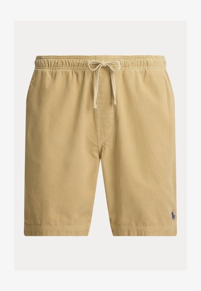 Μπεζ βερμούδα από κορδόνι ύφασμα με ελαστική μέση και κορδόνι ρύθμισης, με μικρό σκούρο λογότυπο κεντημένο κοντά στο τελείωμα στο αριστερό πόδι.