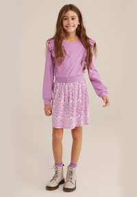 Light purple dress with ruffled sleeves and floral print skirt. Cotton blend fabric; paired with beige boots and purple socks.