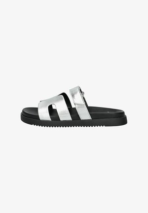 Silver metallic slide sandal with two wide straps and a black rubber sole featuring a textured bottom for grip. Minimalist design.