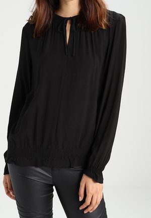 Blusa nera a maniche lunghe con scollo a chiave, cintura arricciata e polsini elastici. Tessuto liscio con una texture leggera.