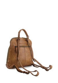 Brown leather backpack with adjustable straps, single top handle, front zip pocket, smooth texture, and rounded shape with stitching details.