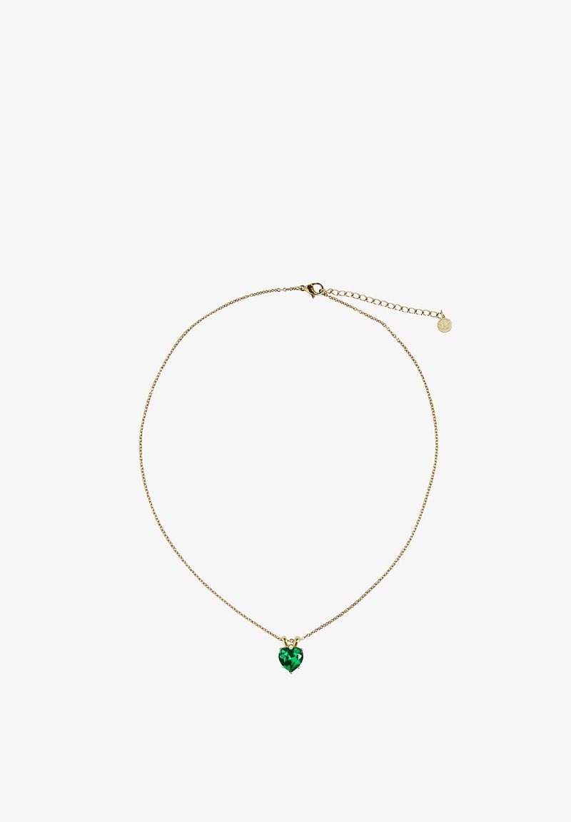 Collier délicat en chaîne d'or avec un petit pendentif en pierre précieuse verte en forme de cœur et fermoir réglable avec chaîne d'extension.