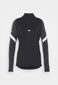 Czarna, długosleeve'owa koszula z ćwiartkowym zamkiem, z teksturowanymi rękawami i białymi akcentami. Wykonana z oddychającego, elastycznego materiału.
