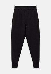 Schwarze Jogginghosen mit elastischem Bund, schmal zulaufenden Beinen und gerippten Bündchen. Aus weichem Stoff, geeignet für die Freizeit.