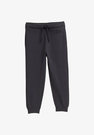 Graue Jogginghosen mit elastischem Taillenbund, Kordelzug und seitlichen Taschen. Hergestellt aus weichem Stoff mit schmal zulaufenden Beinen und gerippten Bündchen.