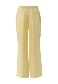 Hellgelbe Cargo-Hosen aus weichem Stoff, mit elastischem Bund und zwei Seitentaschen mit flachen Klappen. Weit geschnittenes Design.
