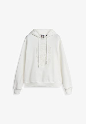 Hoodie blanc avec un motif de skull texturé à l'avant. Équipé d'une capuche avec cordon de serrage et de poignets et d'une taille côtelés. Fabriqué à partir de matériau doux.