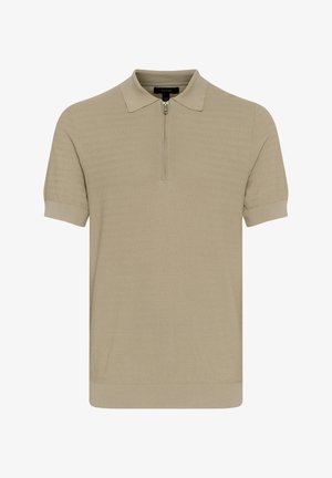 Bež polo majica z zadrgo, kratkimi rokavi, teksturirano tkanino z vzorcem cik-cak ter rebrastimi manšeti in robom.