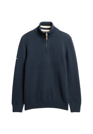 Marineblauwe pullover trui met een hoge geribde kraag, halve rits en geribde manchetten. De binnenkant van de kraag heeft een gestreept patroon.
