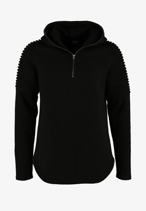 Schwarze Kapuzenjacke mit gerippten Details an den Schultern, einem halben Reißverschluss vorne und einem weichen, strukturierten Stoff. Abgerundeter Saum mit langen Ärmeln.