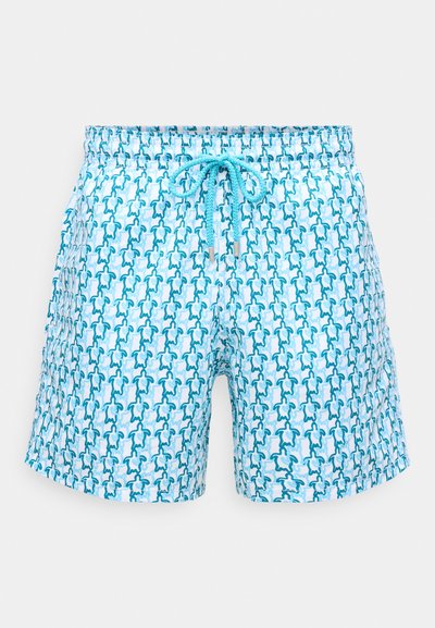 Svetlo modré plavky s viazaním v páse a opakujúcim sa vzorom malých tmavozelených a svetlomodrých morských korytnačiek.