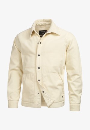 Cremefarbene Cordjacke mit kragenförmigem Ausschnitt, vorderer Druckknopfleiste, zwei großen aufgesetzten Taschen und gerippten Manschetten. Verfügt über einen strukturierten Stoff.