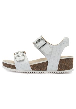 White platform sandals with textured synthetic upper, two adjustable straps, cork midsole, and serrated rubber outsole.