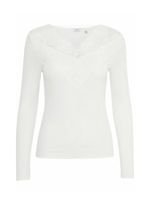 White long-sleeve top featuring a lace v-neck design, soft fabric, fitted shape, and smooth texture. Lace details on the yoke and shoulders.
