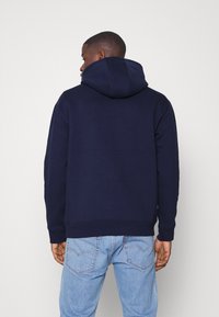 Tommy Jeans REFLECTIVE FLAG HOODIE - Sweatshirt com capuz - twilight navy