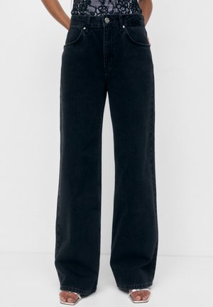 Vaqueros a campana - black denim