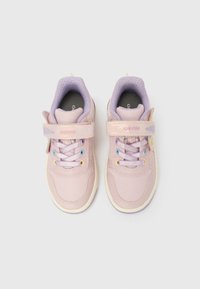 Pair of pink and lavender kids' sneakers with Velcro straps and pastel-colored eyelets viewed from above on white background.