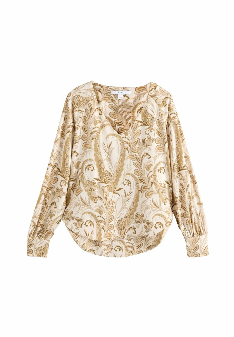 Blouse à manches longues en tissu crème léger avec un motif paisley dans des tons dorés et bruns, dotée d'un décolleté en V et de manches froncées.