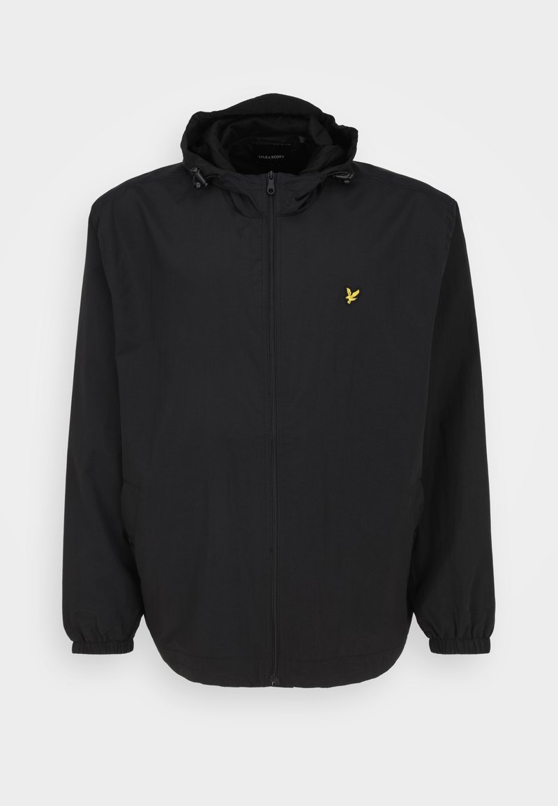 Veste zippée noire avec capuche, poignets élastiques et un petit logo d'oiseau jaune sur la poitrine. Tissu lisse avec un design léger.