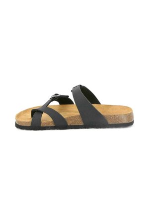 Sandalo nero con cinturini, plantare in sughero e fibbia regolabile, suola piatta e design con punta aperta su sfondo bianco.