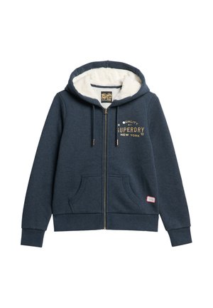 Lukket hættetrøje i mørkeblå bomuld med en cremefarvet fleeceforing, guldlogo på brystet, to foranliggende lommer og snoretræk i hætten.