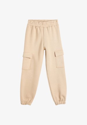 Beige sweatpants with an elastic waistband, tapered cuffs, and two side pockets. Made from soft fabric with a smooth texture.