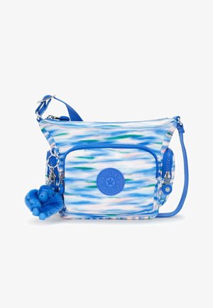 Petit sac bandoulière bleu et blanc à motif, avec poche zippée à l'avant, patch logo rond, fermeture éclair latérale, sangle réglable et porte-clés singe en peluche bleu.