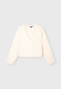 V-Ausschnitt, langärmliger Pullover aus weichem, strukturiertem Creme-Stoff. Kurz geschnittenes Design mit lockerer Passform, ausgestattet mit einem dezent gestickten Etikett am Bund.