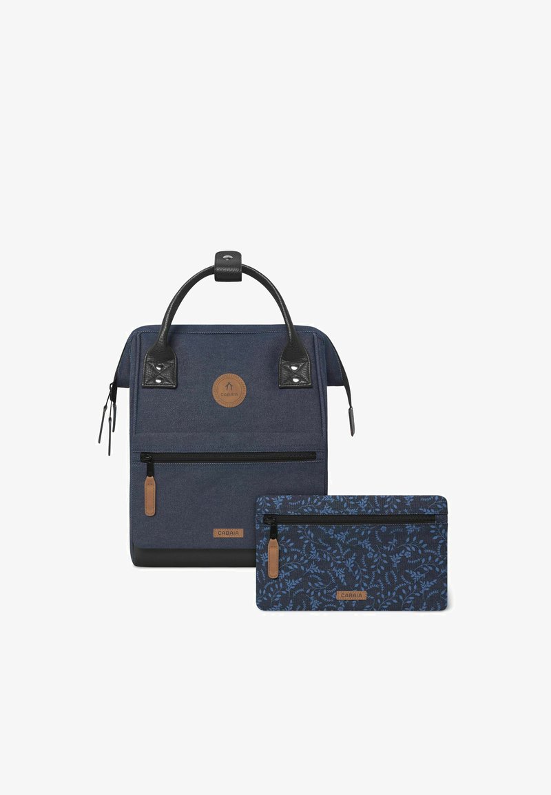 Navy blue backpack with a textured finish, black leather accents, round logo patch, front zip pocket, and detachable navy floral pouch.