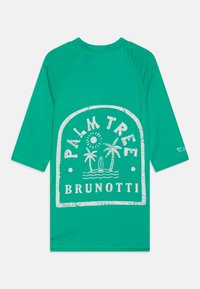 Rash guard verde con una grafica bianca di una palma, sole e tavole da surf, con la scritta "PALM TREE BRUNOTTI". Design a maniche lunghe.