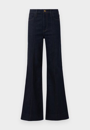 Dark blue denim flared jeans with a high waist, front pockets, and visible stitching. The fabric has a smooth texture and structured shape.