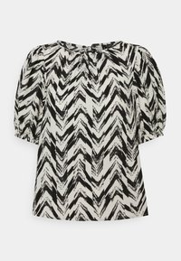 Top a maniche corte con motivo a zigzag nero su sfondo crema. Realizzato in tessuto leggero con scollatura arricciata e polsini elasticizzati.