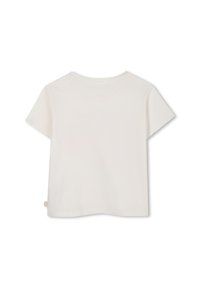 T-shirt à manches courtes en coton crème doux. Col rond, coupe décontractée et design minimaliste sans motifs ni accents visibles.