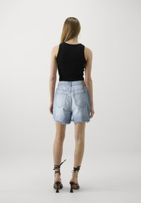 Pieces PCSUMMER DEST - Shorts di jeans - light blue
