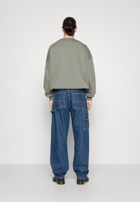 Dr.Denim COLT WORKER - Calças de ganga de corte relaxado - pebble mid stone