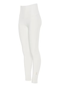 Weiße, hoch taillierte Leggings in voller Länge mit kleinem goldenen Logo nahe dem Knöchel am rechten Bein.